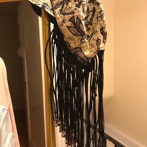 Hat with braids. Missing few beads on the bottom. Can be replaced.